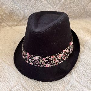 Womens black hat with flowered band. One size fit all.